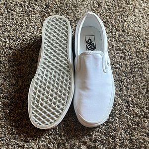 White low top slip on vans. women size 9 and mens size 7.5